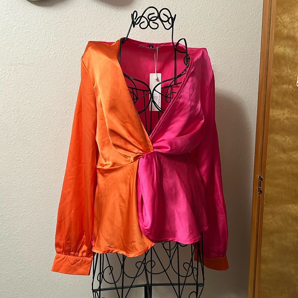 Satin wrap blouse orange and pink it’s a medium size.